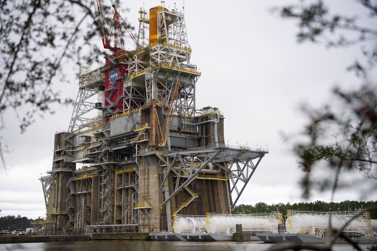 Barges are docked at the B-2 Test Stand at Stennis Space Center on Dec. 4, 2020, in preparation for upcoming Green Run test activities. Teams at the center have been performing Green Run tests of NASA’s Space Launch System core stage and its integrated systems throughout 2020. In mid-December, teams performed the seventh test of the Green Run series – a wet dress rehearsal of a countdown to hot fire. It marked the first time the stage tanks had been loaded with liquid oxygen and liquid hydrogen propellants supplied by the docked barges.